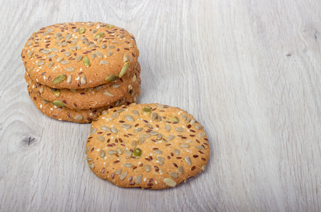 oatmeal cookies with cereals on a wooden boardの写真素材