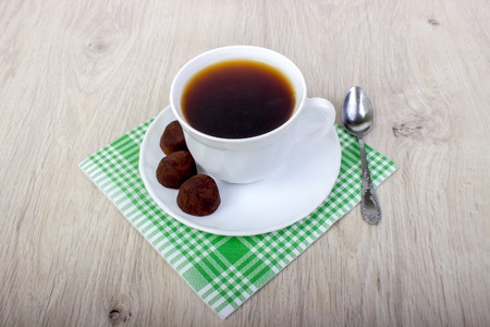 dessert truffle cocoa and coffee cup on a wooden table.の写真素材