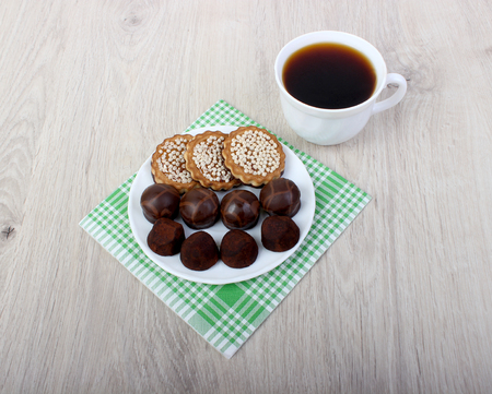 Cup of coffee and cookies on wood backgroundの写真素材