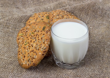 Homemade cookies and milk on textile surfaceの写真素材