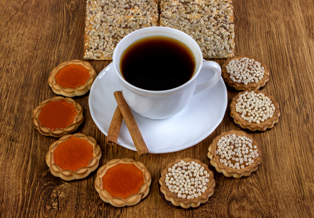 Cup of coffee and cookies on wood backgroundの写真素材