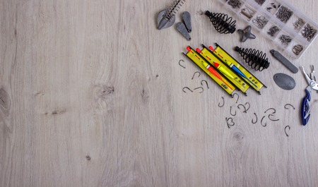 Fishing tackles hooks, fishing line, cargo, float, fishing accessories on a tableの写真素材