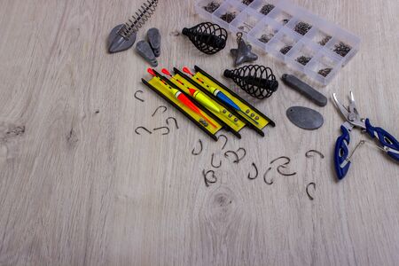 Fishing tackles hooks, fishing line, cargo, float, fishing accessories on a tableの写真素材