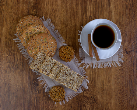 Cup of coffee and cookies on wood backgroundの写真素材