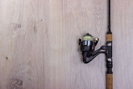 Spinning, baubles on a wooden background. Fishing equipmentの写真素材