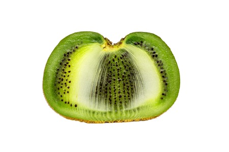 fruits, diet, food and objects concept - close up of ripe kiwi slice on tableの写真素材