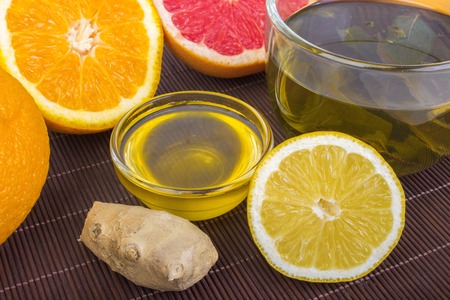 traditional medicine, health, ethnoscience concept and folk remedy - cup of herbal tea, honey,...