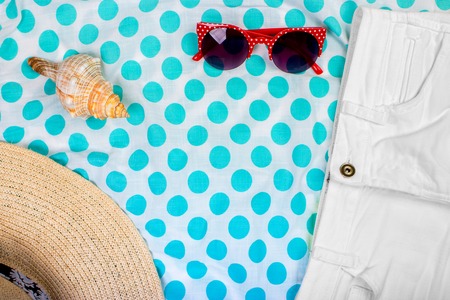 Straw Beach Woman's Hat Sun Glasses Top View Seashell Shorts with space for text.の写真素材