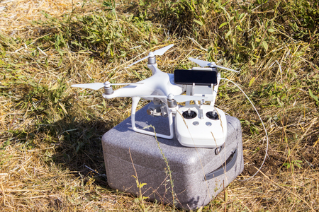 Equipment for driving an unmanned aerial vehicle with a mobile phone and remote control in the field