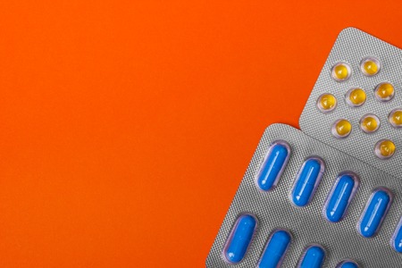 Packs of pills - abstract medical background. Colored Pills.