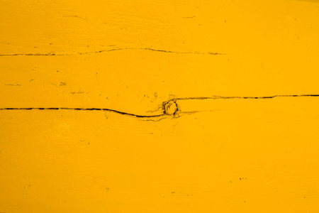 vertical picture of old horizontal planks with bright yellow paintの写真素材