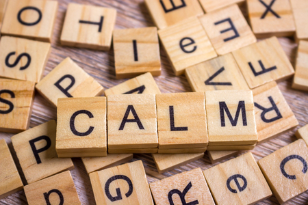 calm Word on Background of cubes with letters. Sign with wooden cubesの写真素材