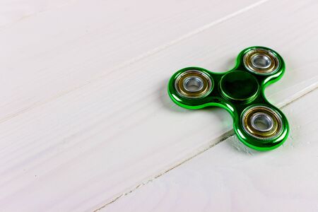 Close up shot of an green fidget spinnerの写真素材