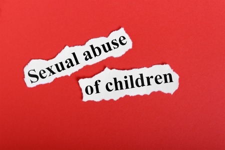 Sexual abuse of children. Word sexual abuse of children on a piece of paper. Concept Image.の写真素材