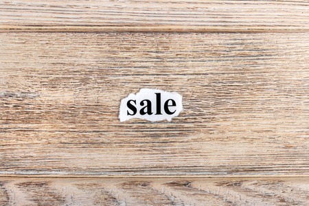sale text on paper. Word sale on torn paper. Concept Image.の写真素材
