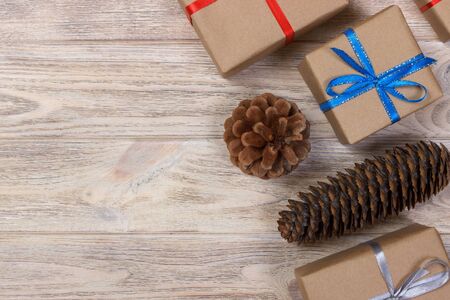 top view of Christmas gifts and cones with decorations.の写真素材