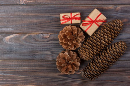 Natural Christmas Accessories Pine Cones Wooden Star Decorated Linen Cord Cinnamon Vintage Gifts on Wooden Background.の写真素材