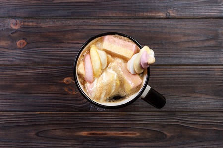 Hot chocolate in a cup with marshmallows on Wooden backgraund.の写真素材