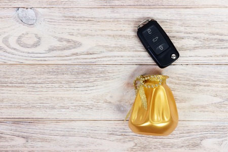 Black car key in a present box. Top view, copy space.の写真素材