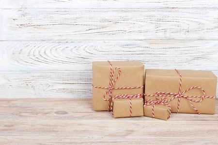 Gift box on the wooden background. Red ribbon. Valentine Day gift.の写真素材