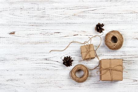 crafted gift on rustic wooden background with Christmas decoration.の写真素材