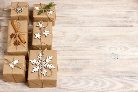 Christmas presents with hand made decorations. Place for text. decorations for wrapped in craft paper gifts.の写真素材