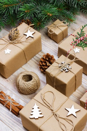 Christmas composition. christmas gifts with pine branches and christmas decoration on white...
