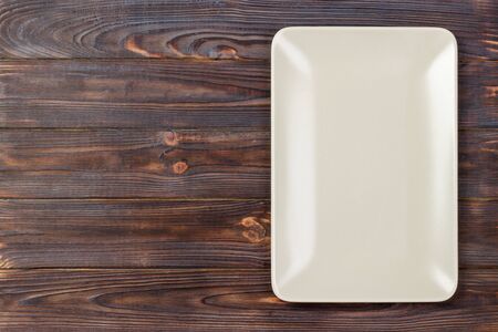 empty rectangular Plate on wooden table background.の写真素材