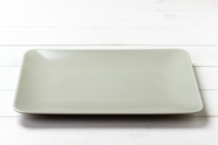 empty rectangular Plate on wooden table background.の写真素材