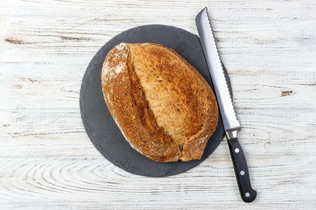 bread loaf on Black Slate Board. Top view.