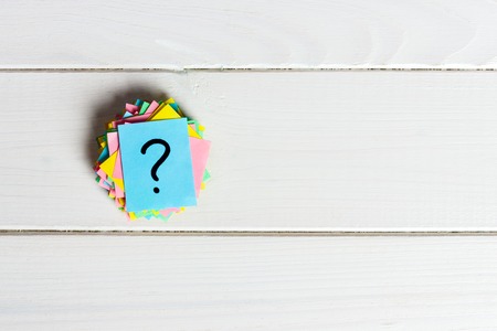 Just a lot of question marks on colored papers.の写真素材