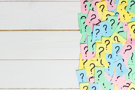 Concept for confusion, question or solution. question mark on wooden background.の写真素材