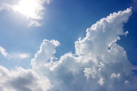 Blue sky with clouds on sunny day.