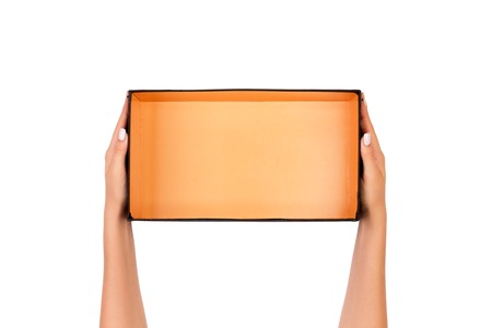 A woman hands hold a white empty paper box container, tidy and top view isolated white.