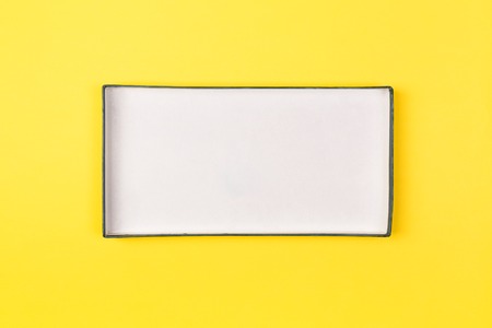 Empty box for product on yellow background. top view.