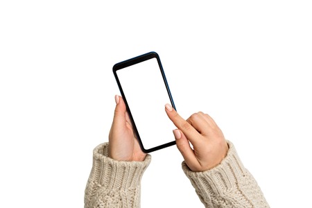 Christmas online shopping. female hands in sweater Touch screen mobile phone. Woman typing on mobile...