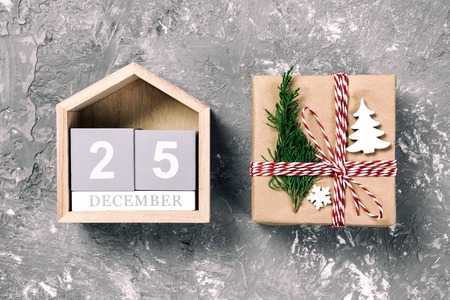 Christmas calendar 1 december. Christmas gift, fir branches on vintage, toned wooden white background. Copy space, top view.の写真素材