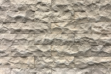 Grey brick wall texture background. Tiled with cope space.