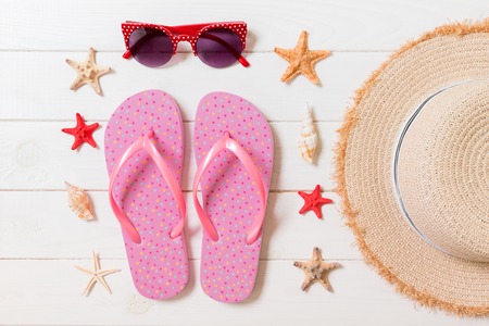 Travel and vacation accessories on a white wooden background. top view summer holiday concept with...
