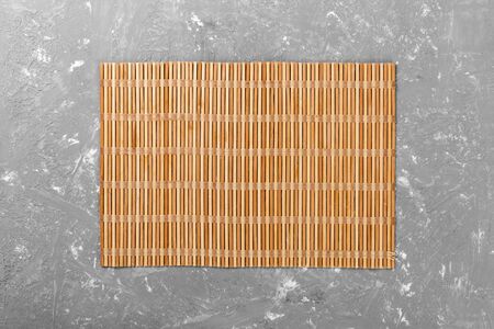 Empty Asian Food Background. brown Bamboo mat on wooden background top view with copy space flat lay.の写真素材