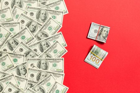 Heap of hundred Dollar Bills on colored background top view, with empty place for your text business money concept.の写真素材
