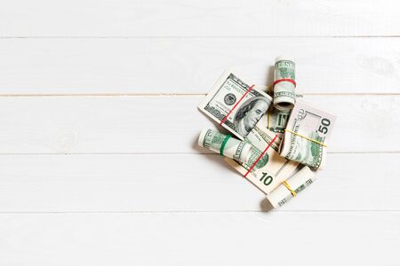 US Dollar bills bundles stack. one hundred dollar bills with stack of money in the middle. Top view of business concept on background with copy space..の写真素材