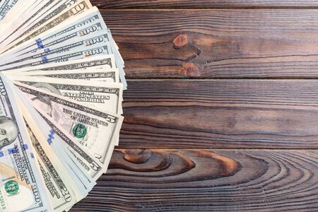 US Dollars: Untidy fan of various US dollar bills Top view of business concept on colored background.の写真素材