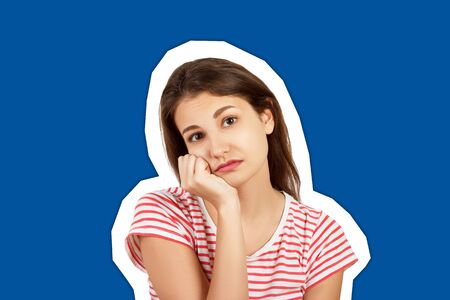 A young sad woman. emotional girl Magazine collage style with trendy color background.の写真素材