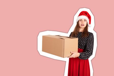 shocked excited girl standing and holding big gift carton box. Magazine collage style with trendy color background. holidays concept.の写真素材