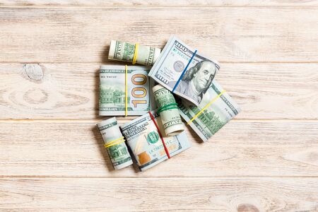 Many Stack of 100 dollar bills. Isolated on colored background top view with copy space.