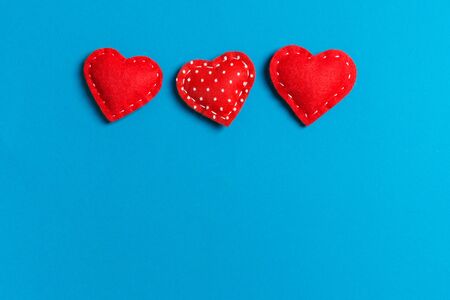 Top view of textile hearts on colorful background. Valentine's day concept with copy space.の写真素材