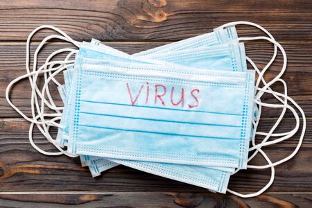virus stop word written on medical mask. virus text on protective mask