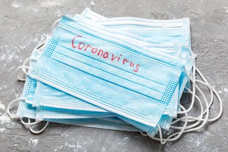 coronavirus word written on medical mask. Coronavirus text on protective maskの写真素材