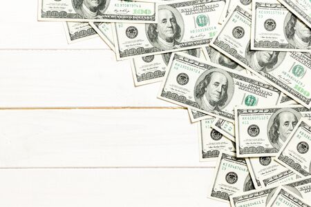 dollar bills a on a light colored background. copy space, top view business concept.の写真素材